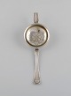 Danish 
silversmith. 
Antique silver 
(830) tea 
strainer. Dated 
1874.
Length: 18 cm.
In excellent 
...