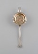 Danish 
silversmith. 
Antique silver 
(830) tea 
strainer. Dated 
1873.
Length: 19 cm.
In excellent 
...