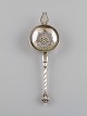 Danish 
silversmith. 
Antique silver 
(830) tea 
strainer. Dated 
1864.
Length: 19 cm.
In excellent 
...