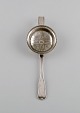 Danish 
silversmith. 
Antique silver 
(830) tea 
strainer. Dated 
1852.
Length: 19 cm.
In excellent 
...