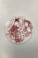 Red monthly plate in faience for December "MIRAKEL" (miracle). Designed by Bjørn Wiinblad for ...