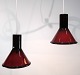A pair of pendants from Holmegaard in reddish colors from around the 1950s.Measurements in cm: ...