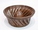 Pudding form of 
earthenware in 
brownish colors 
from around the 
1930s
Measurements 
in cm: H:11 ...