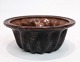 Pudding form of 
earthenware in 
brownish colors 
from around the 
1930s
Measurements 
in cm: H:9.5 
...