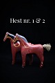 Decorative, 
small carved 
wooden horse 
with old paint 
and fine 
patina. 
H: 14cm. L: 
14cm. ( ...