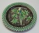 Ceramic dish, Humlebæk, Denmark. White base with liveries in brown, yellow, blue and green. ...