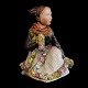 Carl Martin 
Hansen for 
Royal 
Copenhagen; A 
porcelain 
figurine of a 
Amager girl 
#12412. ...