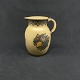 Height 8.5 cm.
Nice milk jug 
in Hjorth dark 
brown 
stoneware.
It is 
decorated with 
grapes, ...