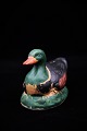 Old Swedish piggy bank in the form of duck in painted ceramic.H:10,5cm. L:14cm.