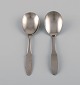 Gundorph 
Albertus for 
Georg Jensen. 
Two Mitra jam 
spoons in 
stainless 
steel. 1970s.
Length: ...
