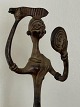 Large bronze figure of woman combing her hair and 
looking in the mirror. Asia