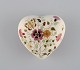 Heart-shaped 
Zsolnay lidded 
box in 
cream-colored 
porcelain with 
hand-painted 
flowers, ...