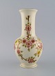 Zsolnay vase in 
cream-colored 
porcelain with 
hand-painted 
flowers and 
gold 
decoration. 
Late 20th ...