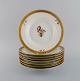 Eight Royal 
Copenhagen 
Golden Basket 
deep plates in 
hand-painted 
porcelain with 
flowers and 
gold ...