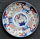 Large Imari porcelain dish, Meiji period, 19./20. century Japan. Polychrome decorated with ...