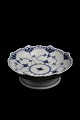 Royal 
Copenhagen Blue 
Fluted Half 
Lace compote 
bowl on foot.
H:6cm. 
Dia.:17cm. 
Decoration ...