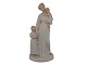 Rare and small 
Royal 
Copenhagen Art 
Nouveau 
figurine, 
mother with two 
children.
Decoration ...