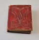 Miniature photo album in red leather, 19th century Denmark. Containing miniature photographs of ...
