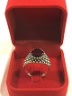 A silver ring 
in 925 s with 
large ruby red 
stone size 67