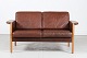 Danish ModernTwo seater sofa made of oak upholsteredwith dark cognac colored/brown leather ...