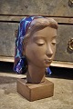 Johannes Hedegaard - Aluminia, stoneware woman's head with scarf glazed in blue. Height: 33cm. ...