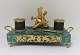Ink house with base of malachite, and gilded soldier. Length 28 cm. Width 14 cm. Height 14 cm. ...
