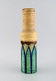 Italian studio 
ceramicist. 
Cylindrical 
vase in glazed 
stoneware. Hand 
painted green 
leaves on ...