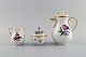 Meissen coffee 
pot, sugar bowl 
and cream jug 
with 
hand-painted 
flowers and 
gold 
decoration. 
Lids ...