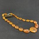 Length 62 cm.Fine necklace with amber jewelery in a course tied with individual knots.It ...