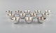 Elon Arenhill 
(1922-2018). 
Well-known 
Swedish 
silversmith. 
Twelve 
modernist cups 
in hammered ...