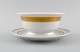 Royal 
Copenhagen 
service no. 
607. Porcelain 
sauce bowl. 
Gold border 
with foliage. 
Model number 
...