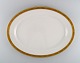 Royal 
Copenhagen 
service no. 
607. Colossal 
serving dish in 
porcelain. Gold 
border with 
foliage. ...