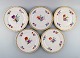 KPM, Berlin. 
Five antique 
dinner plates 
in curved 
porcelain with 
hand-painted 
flowers and 
gold ...