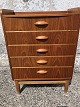 Chest of drawers in teak veneer with oak legs. Danish modern from the 1960s.Dimensions: ...