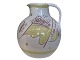 Royal 
Copenhagen art 
pottery, large, 
unique milk 
pitcher with 
swan in yellow 
and violet ...