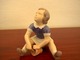 Bing & Grøndahl 
has produced 
this figurine 
of a girl 
holding a 
bucket. 
Decoration 
number ...