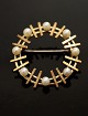 14 carat gold 
brooch D. 3.4 
cm. with 
genuine pearls 
from jewelers  
Herman 
Siersb&#65533;l 
...