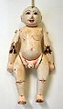 Antique painted boy doll, China, 19th century. With moving parts. H.: 21 cm.
