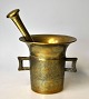 Danish brass mortar with pestle, 19th century. With two handles and decorations on the side. H.: ...