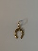 Horse shoe in 
14 karat gold
Stamped 585 BH
Height 25.32 
mm approx
Thickness 1.00 
mm ...