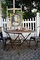 Old garden table from the South of France with raw stone top and wrought iron base with a super ...