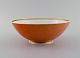 Royal 
Copenhagen 
Jægersborg 
porcelain bowl. 
Orange with 
gold 
decoration. 
1920s.
Measures: 22.5 
...
