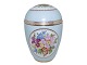 Royal Copenhagen light blue lidded vase with flowers.The factory mark tells, that this was ...