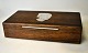 F. Hingelberg tobacco box in moss oak with silver inlay with motif of the Tollundman, 1950-60s, ...