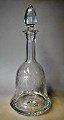 Crystal 
decanter with 
cuttings, 20th 
century. 
Guilloted with 
tendrils and 
bow. With prop. 
H.: ...