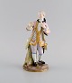 Antique Meissen porcelain figure. Noble gentleman with gold watch. Late 19th century.Measures: ...