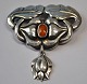 Danish art nouveau brooch in silver with amber, approx. 1910. Decorated with foliage and ...