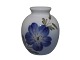 Royal 
Copenhagen 
miniature vase 
with blue 
flower.
The factory 
mark tells, 
that this was 
...