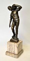 Beck, Ernst (1879 - 1941) Germany: The Stone Bearer. Patinated bronze on alabaster plinth. ...