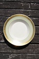 Dagmar with 
gold rim China 
porcelain 
dinnerware by 
Royal 
Copenhagen, 
Denmark. 
Porridge plate 
...